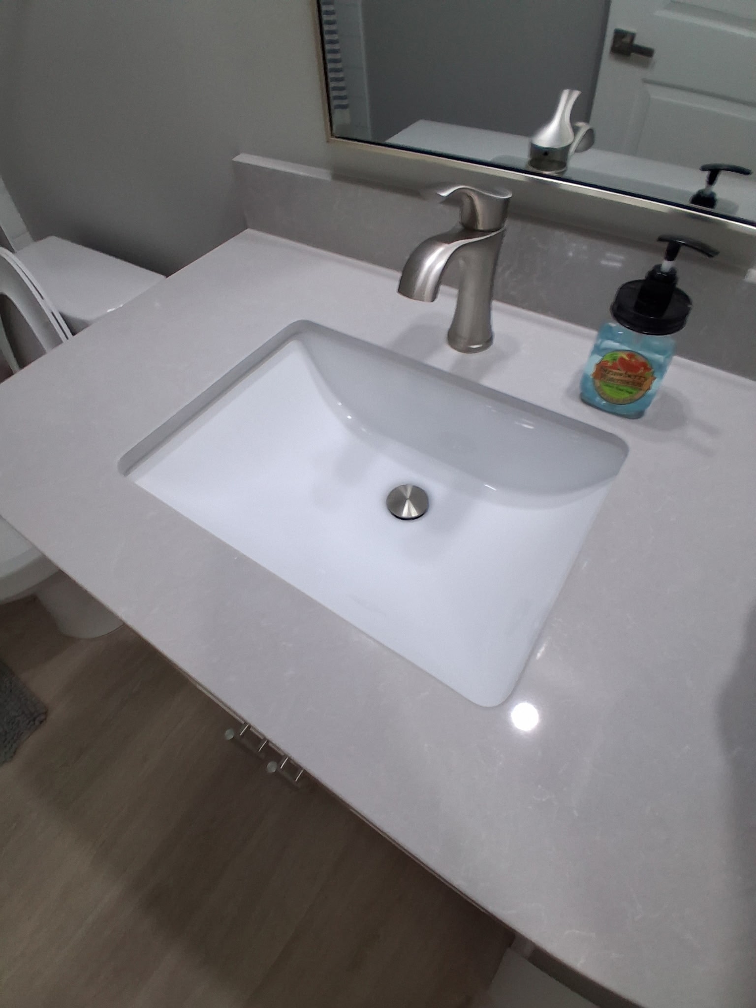 Gleaming bathroom vanity and sink after deep clean