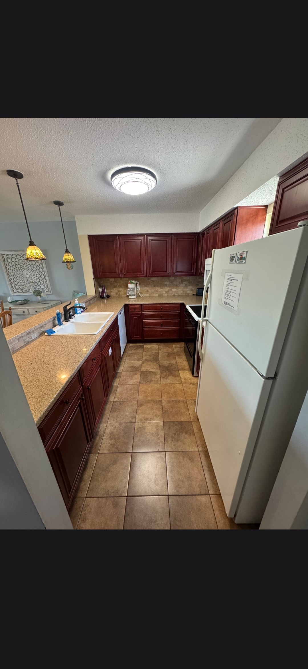 Spotless kitchen with dark cabinetry after professional clean