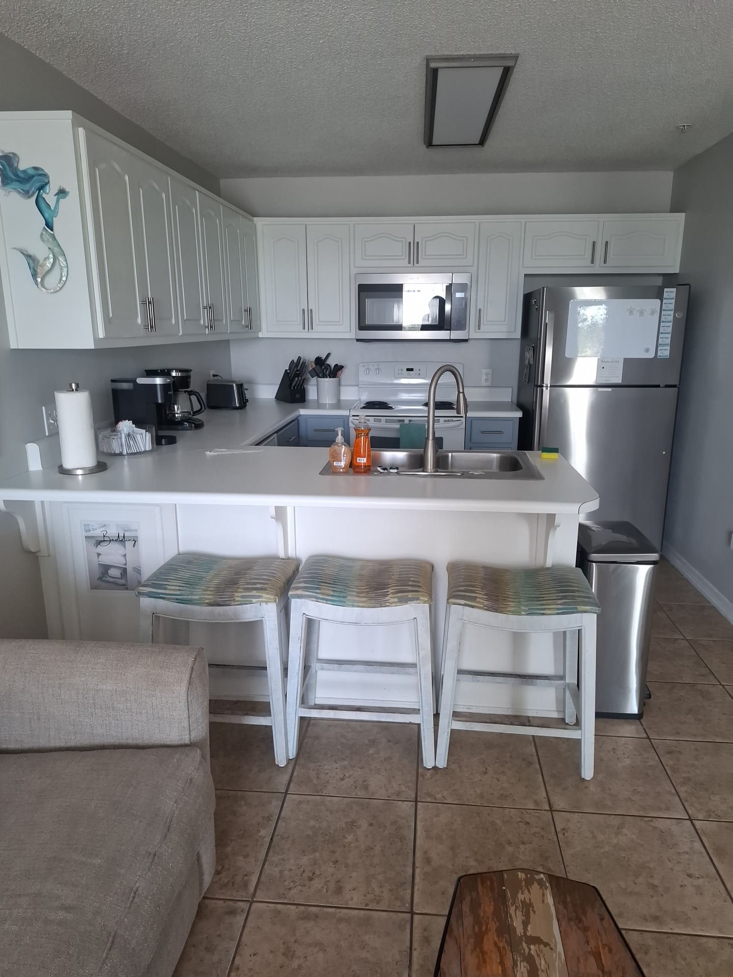 Bright white kitchen cleaned and ready for guests